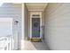 Inviting front entrance with a gray door, a welcome mat, and charming decorations at 1417 Underbrush Dr, Durham, NC 27703