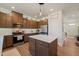 Well-equipped kitchen featuring stainless steel appliances, center island, and ample cabinet space for storage and meal preparation at 1417 Underbrush Dr, Durham, NC 27703