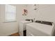 Functional laundry room with modern washer and dryer units at 1417 Underbrush Dr, Durham, NC 27703