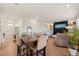 Bright living area with dining table, fireplace, and ample natural light, creating a comfortable and inviting space at 1417 Underbrush Dr, Durham, NC 27703