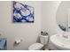 Charming powder room featuring modern fixtures, stylish decor, and ample natural light at 1417 Underbrush Dr, Durham, NC 27703