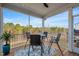 Cozy screened porch with outdoor seating and views of nature at 1417 Underbrush Dr, Durham, NC 27703