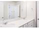 Bright bathroom featuring double sinks, ample counter space, and well-lit mirrors at 173 Little Crk Dr, Lillington, NC 27546