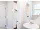 Well lit bathroom with a white vanity, sink, and a large oval mirror at 173 Little Crk Dr, Lillington, NC 27546