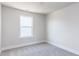 Cozy bedroom featuring plush carpet, a window and neutral walls at 173 Little Crk Dr, Lillington, NC 27546
