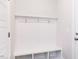 Well designed mudroom featuring a bench, hooks, and storage space at 173 Little Crk Dr, Lillington, NC 27546