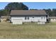 Back exterior view of home with shed at 176 Clear Water Dr, Smithfield, NC 27577