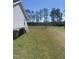 Large grassy backyard with mature trees and ample space for recreation and entertaining at 176 Clear Water Dr, Smithfield, NC 27577