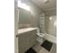 Bathroom with a white toilet, gray vanity, and a shower/tub with a patterned curtain at 176 Clear Water Dr, Smithfield, NC 27577