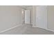 Neutral bedroom featuring carpeted floors, a closet and an open door at 176 Clear Water Dr, Smithfield, NC 27577