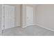 Neutral bedroom featuring carpeted floors and two closets at 176 Clear Water Dr, Smithfield, NC 27577