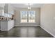 Bright dining area with hardwood floors and large windows providing ample natural light at 176 Clear Water Dr, Smithfield, NC 27577