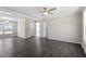 Open-concept living space featuring hardwood floors, ample lighting, and neutral wall colors at 176 Clear Water Dr, Smithfield, NC 27577