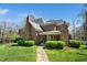 Charming backyard with manicured lawn, pathway, and elegant brick home under a clear blue sky at 2207 Oxford Rd, Raleigh, NC 27608