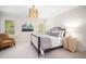 This bedroom features a queen-sized bed, a nightstand, and natural light at 2207 Oxford Rd, Raleigh, NC 27608