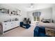 This bedroom includes a daybed, shelves with decorations, and a computer setup at 2207 Oxford Rd, Raleigh, NC 27608
