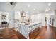 Bright, modern kitchen with an expansive island, white cabinetry, and stainless steel appliances, perfect for entertaining at 2207 Oxford Rd, Raleigh, NC 27608