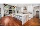 Bright, modern kitchen with an expansive island, white cabinetry, and stainless steel appliances, perfect for entertaining at 2207 Oxford Rd, Raleigh, NC 27608