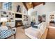 Cozy living room with fireplace, custom built-ins for display and storage and a coffered ceiling at 2207 Oxford Rd, Raleigh, NC 27608
