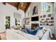 Living room with coffered ceiling, fireplace, and custom built-ins for display and storage at 2207 Oxford Rd, Raleigh, NC 27608