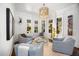 Cozy seating area with armchairs, natural light, and charming decor, ideal for relaxation and conversation at 2207 Oxford Rd, Raleigh, NC 27608
