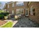 Outdoor patio featuring a built-in grill and stone flooring, ideal for outdoor dining and entertaining at 2207 Oxford Rd, Raleigh, NC 27608