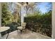 Cozy porch with stone flooring, wrought iron railing, and a view of the surrounding greenery at 2207 Oxford Rd, Raleigh, NC 27608