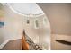 This winding staircase features unique architecture and an elegant chandelier at 2207 Oxford Rd, Raleigh, NC 27608