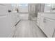 Spacious bathroom showcasing a soaking tub and glass shower between and vanities at 228 Nahunta Dr, Apex, NC 27539