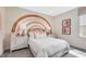 Charming bedroom with a decorative rainbow mural, cozy furnishings, and natural light at 228 Nahunta Dr, Apex, NC 27539