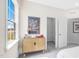 Bright bedroom featuring a cabinet, closet access, and a view of the outdoors at 228 Nahunta Dr, Apex, NC 27539