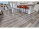 Kitchen bar counter with modern stools leading into an open concept floor plan living room at 228 Nahunta Dr, Apex, NC 27539