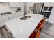 Bright, open kitchen with a large island, stainless steel appliances, and modern orange bar stools at 228 Nahunta Dr, Apex, NC 27539