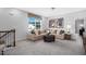 Cozy living room features a comfortable sectional sofa, large windows, and stylish decor at 228 Nahunta Dr, Apex, NC 27539