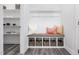Bright mudroom featuring a built-in bench with storage cubbies and decorative accents at 228 Nahunta Dr, Apex, NC 27539