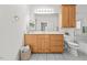 Bathroom with a vanity offering ample storage space, and coordinated tile flooring at 23901 Nc-902, Bennett, NC 27208