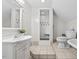 Bright bathroom with modern sink, walk-in shower, and toilet at 23901 Nc-902, Bennett, NC 27208