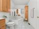 Bathroom featuring a large soaking tub, updated fixtures, and plenty of storage space at 23901 Nc-902, Bennett, NC 27208