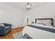 Comfortable bedroom featuring hardwood floors, cozy armchair, and lots of natural light at 23901 Nc-902, Bennett, NC 27208