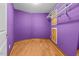 Walk-in closet providing hardwood flooring, storage space, and a custom closet system at 23901 Nc-902, Bennett, NC 27208