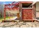 Patio with a brick column, a wooden bench and steps going to the 2nd floor at 23901 Nc-902, Bennett, NC 27208