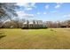 Beautiful home showcasing a metal roof, a well-kept lawn, and curb appeal at 23901 Nc-902, Bennett, NC 27208