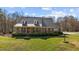 Attractive brick house boasting a metal roof, brick pillars and a lush front lawn at 23901 Nc-902, Bennett, NC 27208