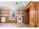 Bright kitchen featuring matching appliances, oak cabinets, and ample counter space at 23901 Nc-902, Bennett, NC 27208