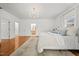 Bright main bedroom with hardwood floors and a door that provides access to the main bath at 23901 Nc-902, Bennett, NC 27208