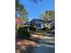 A charming home with a lush front yard, and a covered porch, perfect for enjoying the outdoors at 249 Bailey'S Crossroads Rd, Benson, NC 27504