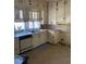 A functional kitchen featuring ample cabinet space, and a double basin sink at 249 Bailey'S Crossroads Rd, Benson, NC 27504