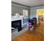 A living room featuring hardwood floors and a fireplace, offering a cozy ambiance at 249 Bailey'S Crossroads Rd, Benson, NC 27504