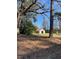Outbuilding with a red roof surrounded by trees at 249 Bailey'S Crossroads Rd, Benson, NC 27504
