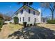 Spacious backyard features a well-manicured lawn, mature trees, and a screened-in porch at 2704 St Marys St, Raleigh, NC 27609